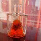 Bottle bottom : with rosebuds, orange ink